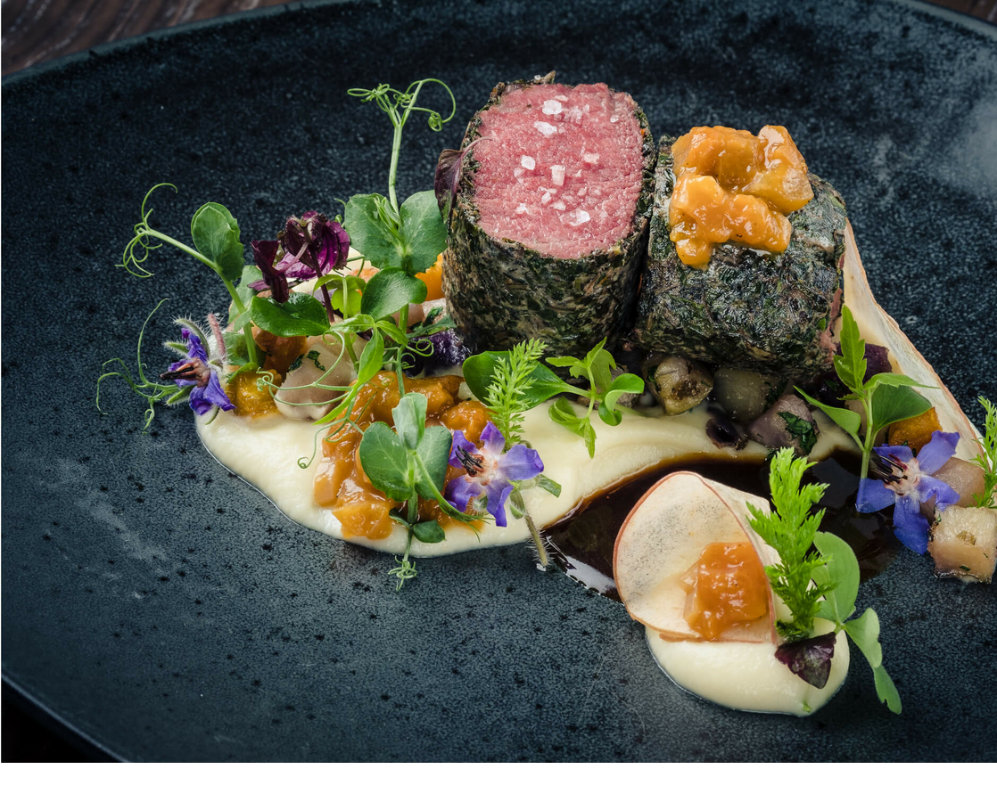 Detailed fillet with edible flowers and herbs